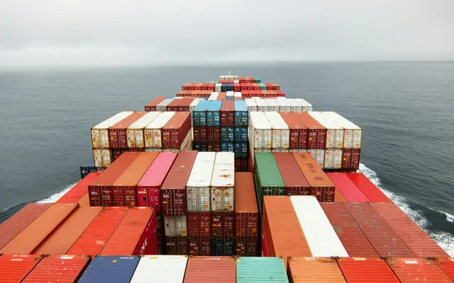View over shipping containers from a vessel at sea