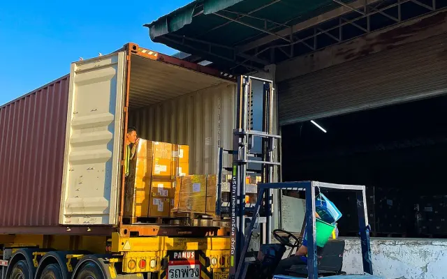 Loading a container at a warehouse