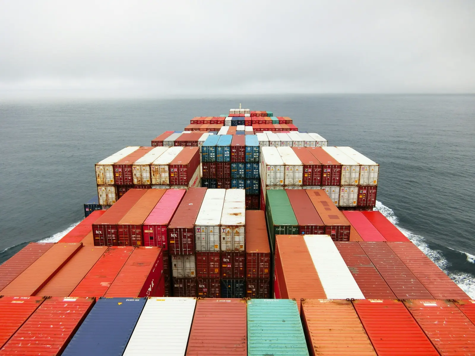 View over shipping containers from a vessel at sea