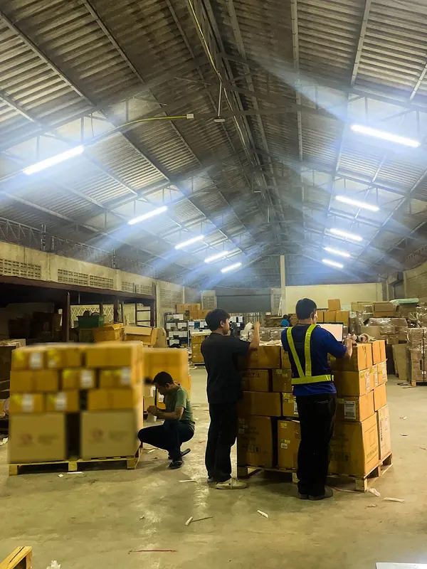Loading palletized cargo inside a shipping container.jpg